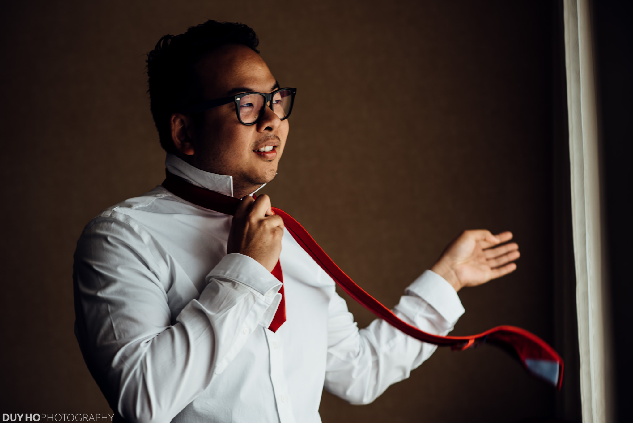 David getting ready with a red tie